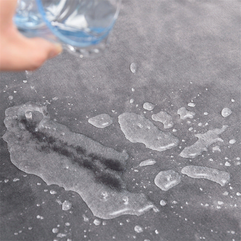 Water beading on the water-resistant surface of the pee pad