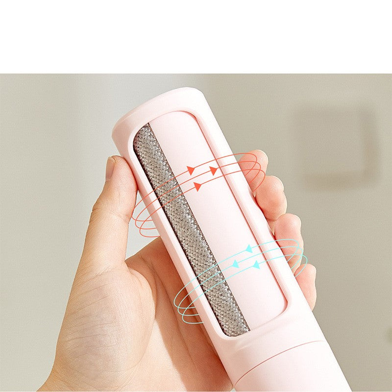 Hand holding the self-cleaning pet hair roller, showing the brush head