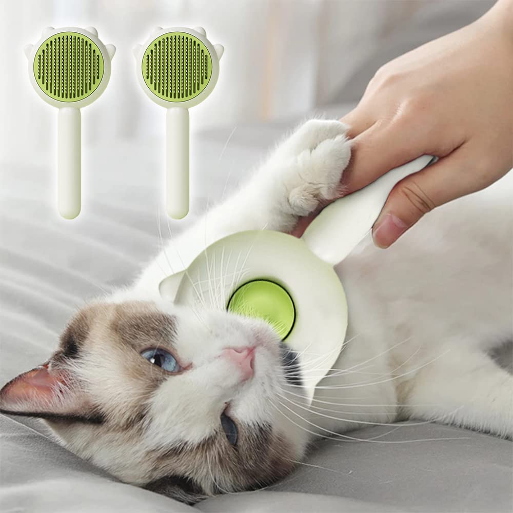 Brushing a cat with the green self-cleaning slicker brush
