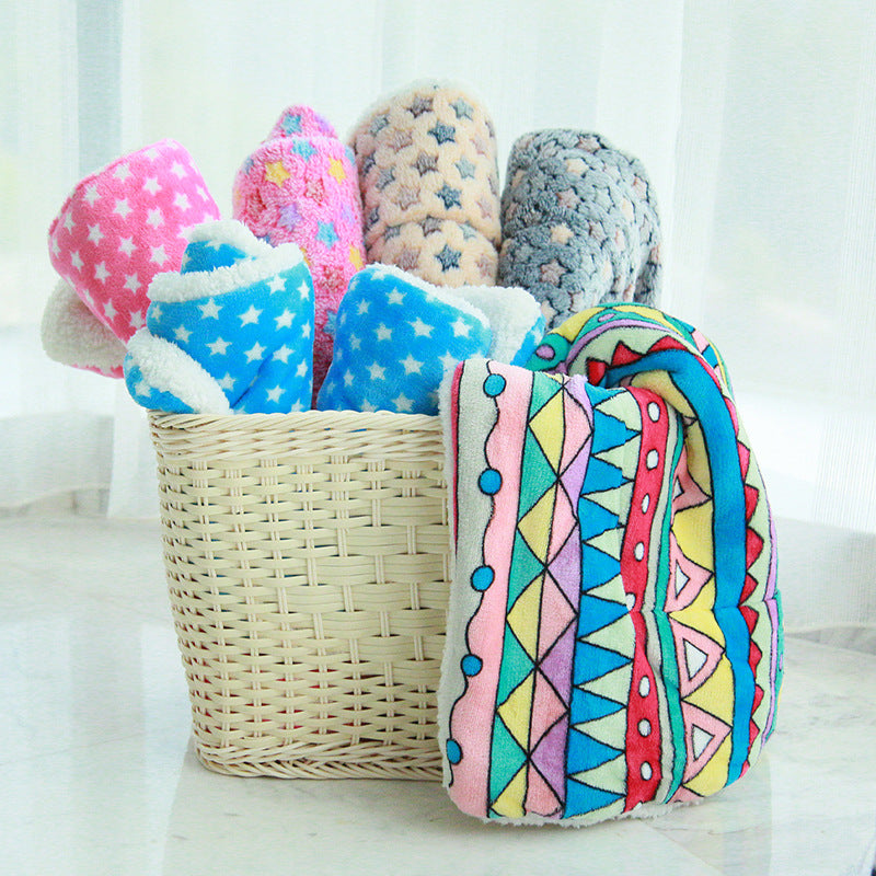 Rolled fleece pet blankets in a wicker basket