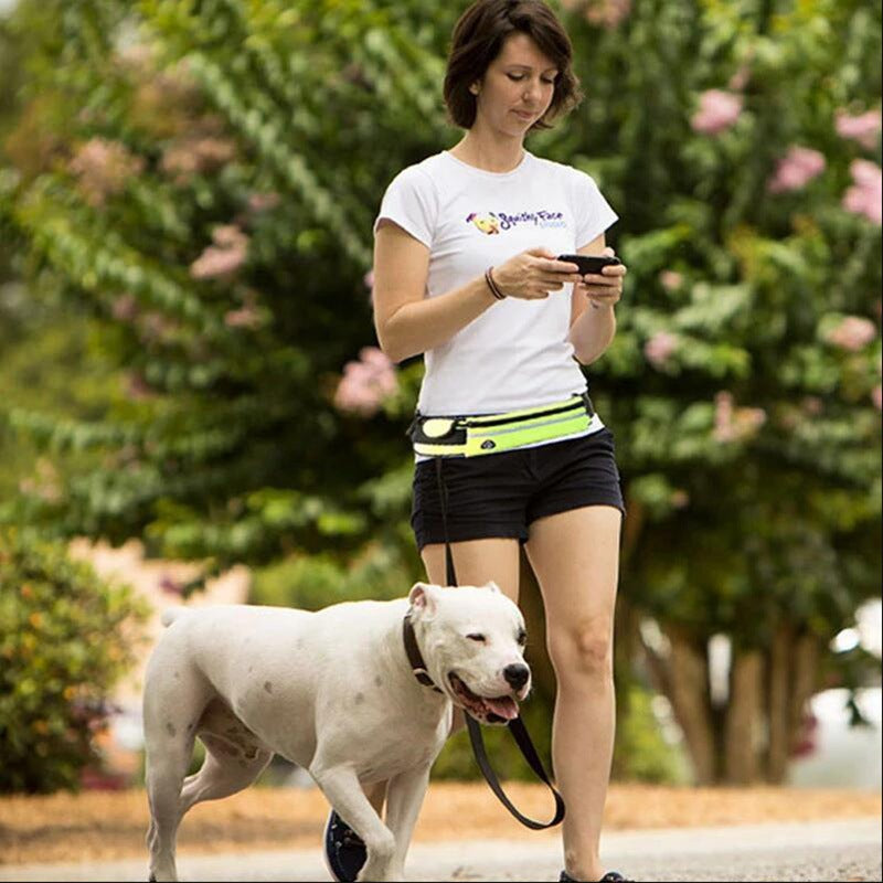 Woman walking a dog with the hands-free leash