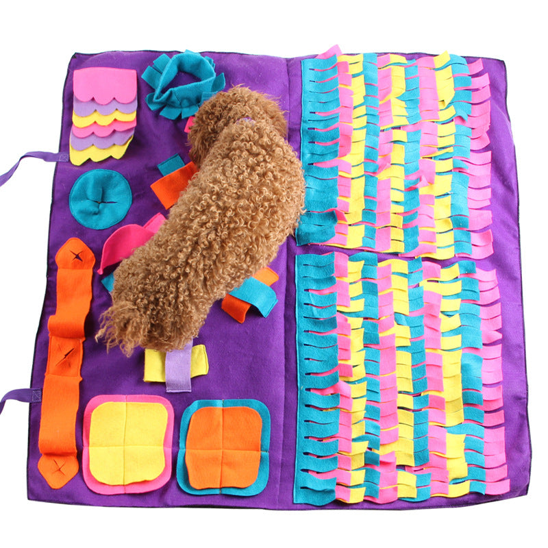 Dog sniffing a large purple snuffle mat
