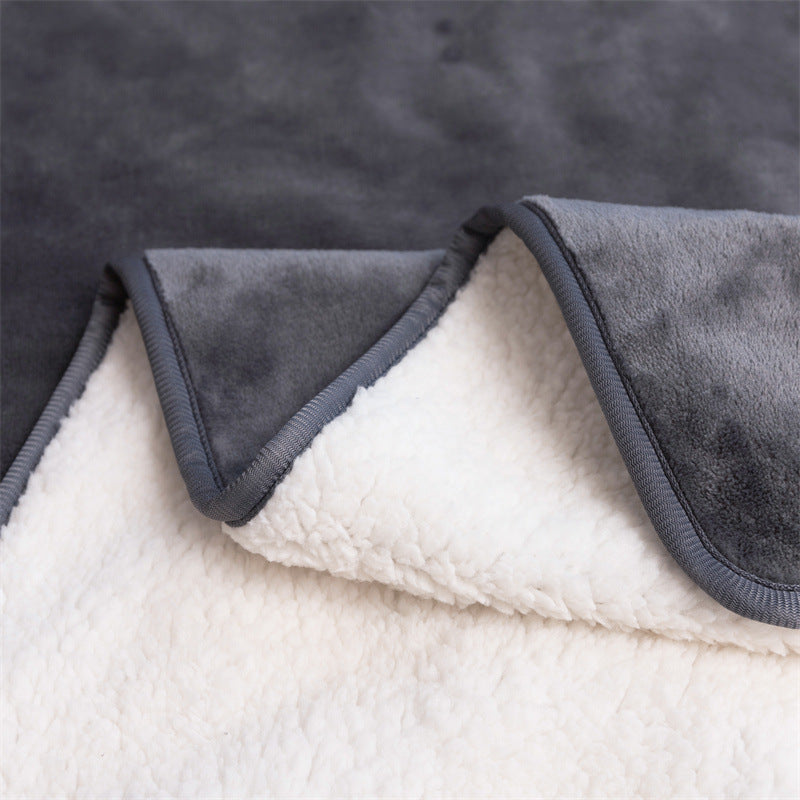 Close-up of the soft white sherpa underside of the gray pad