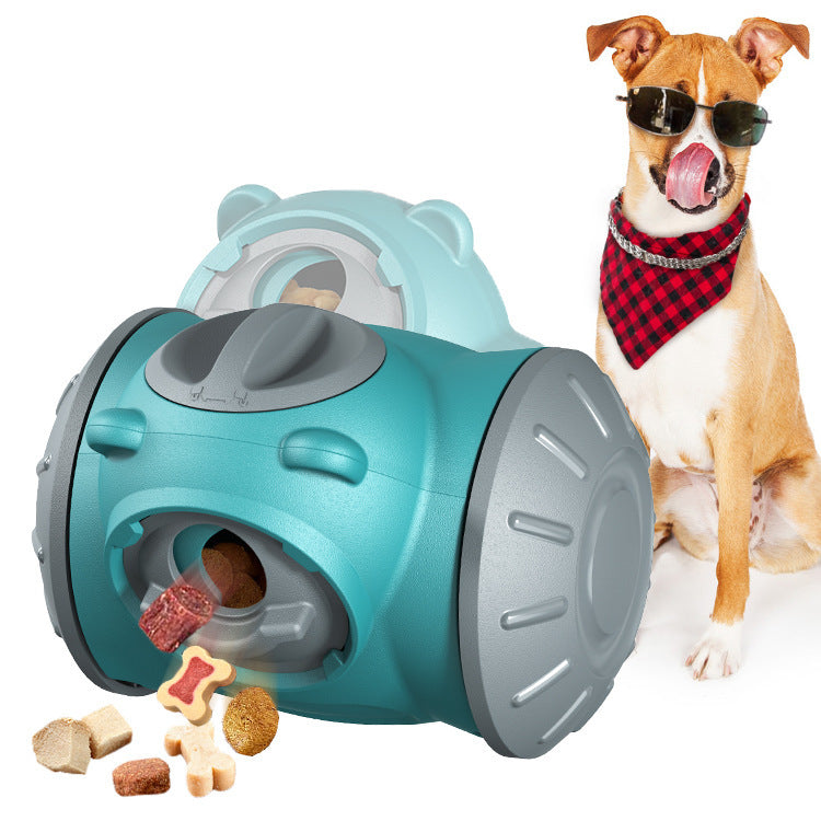 Green treat-dispensing tumbler dog toy with a dog playing