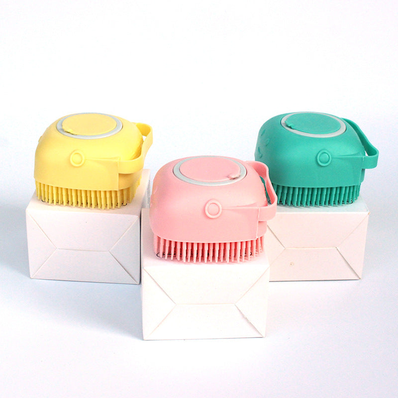 Yellow, pink and green silicone bath brushes